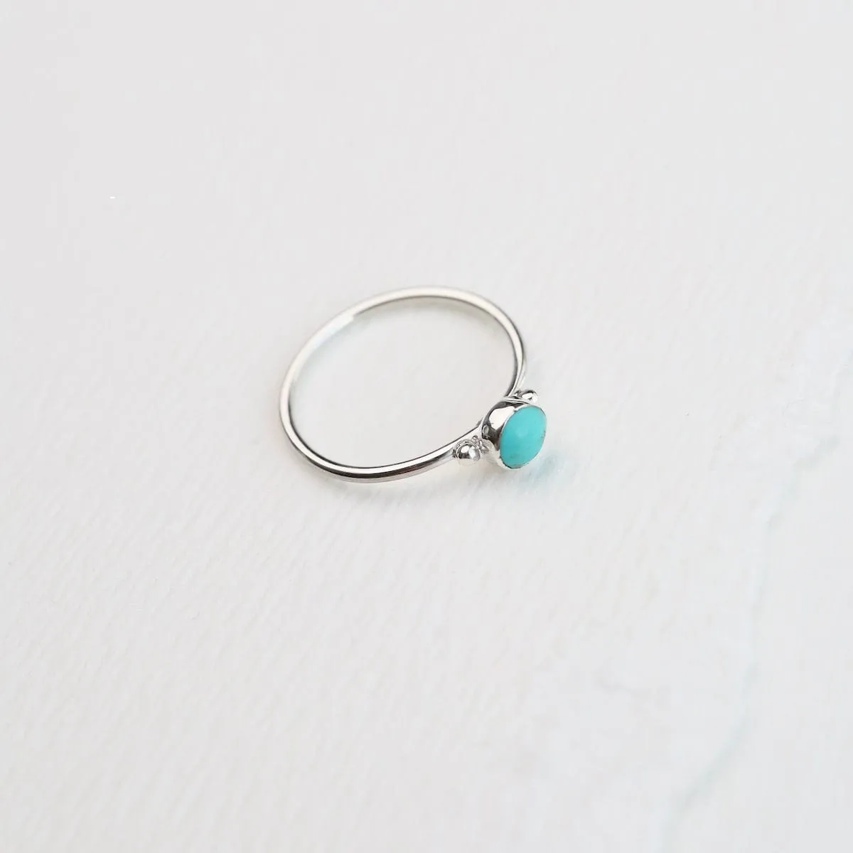 Delicate Compressed Turquoise Round Silver Ring